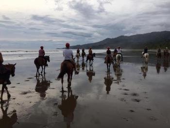 Horseback riding to Hermosa Beach, South Pacific, Costa Rica photo